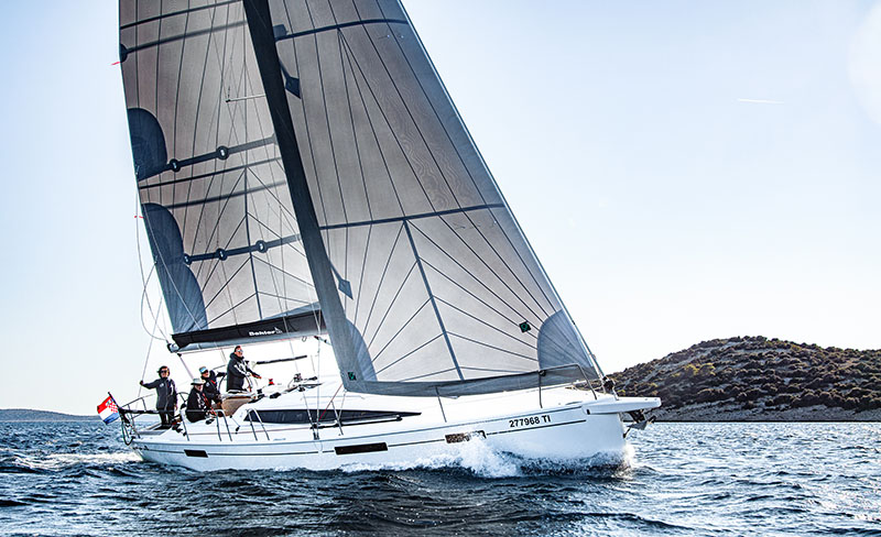 Photo shows sailing crew while having RYA certified practical sailing training at center of sailing center in Croatia.
